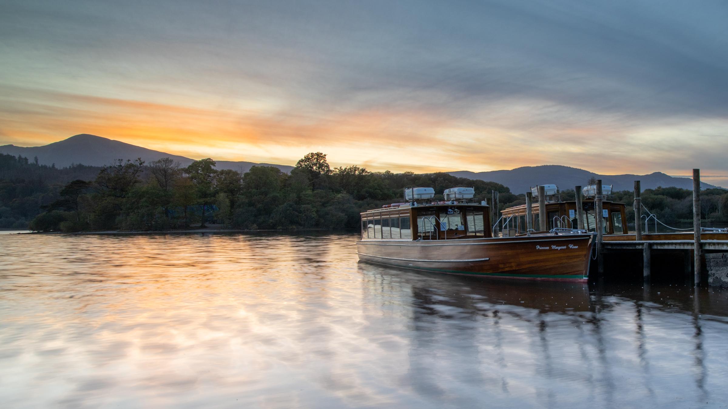 Motor Launch at Keswick shore at sunset⁠