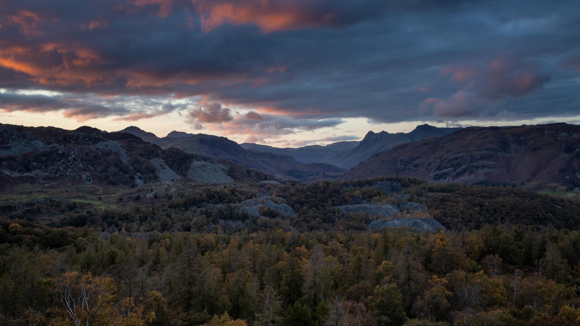 Beautiful moody sky just after sun set looking out from Holme Fell across the numerous quarry workings towards Mickleden flanked by the familar sights of the Wrynose Fells, Pike of Blisco, Bowfell, the Langdale Pikes and Lingmoor Fell