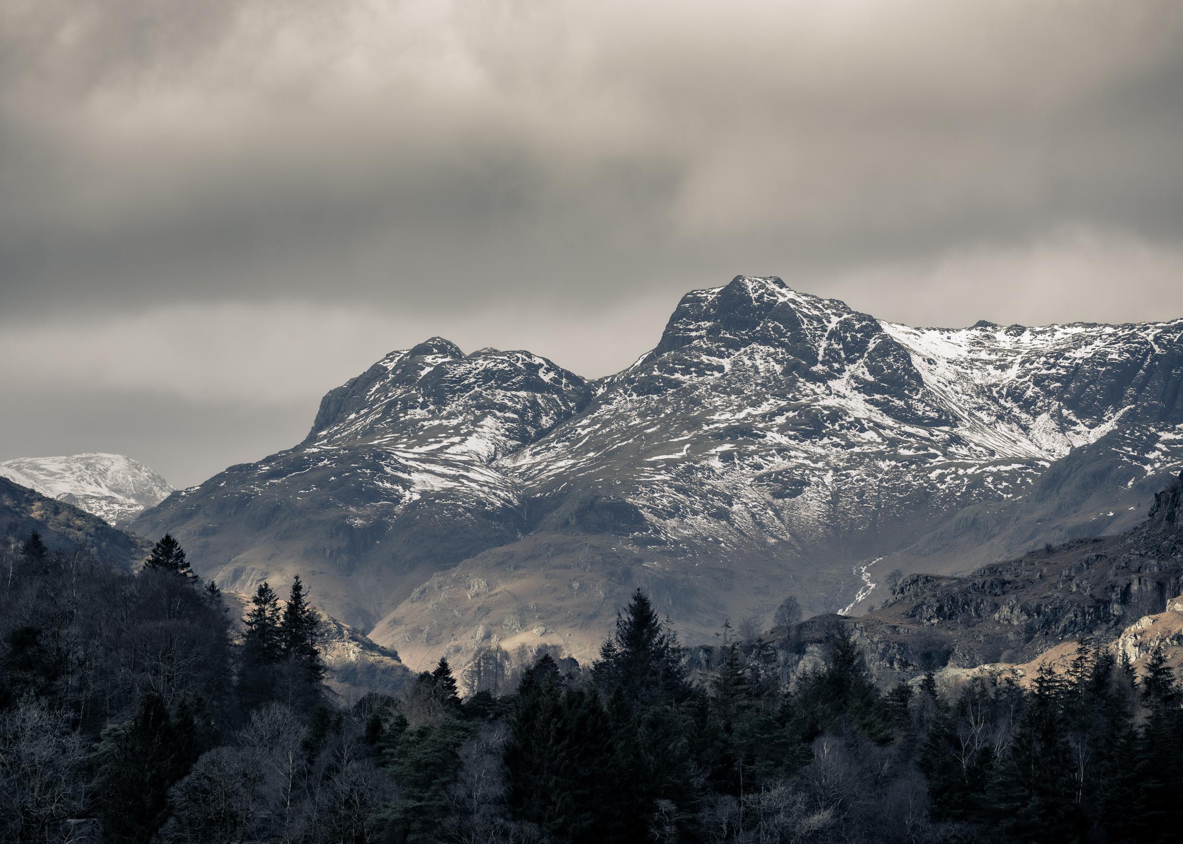 Snow dusted Langdales as the sun lit up the valley leaving the mountains looking dark and foreboding