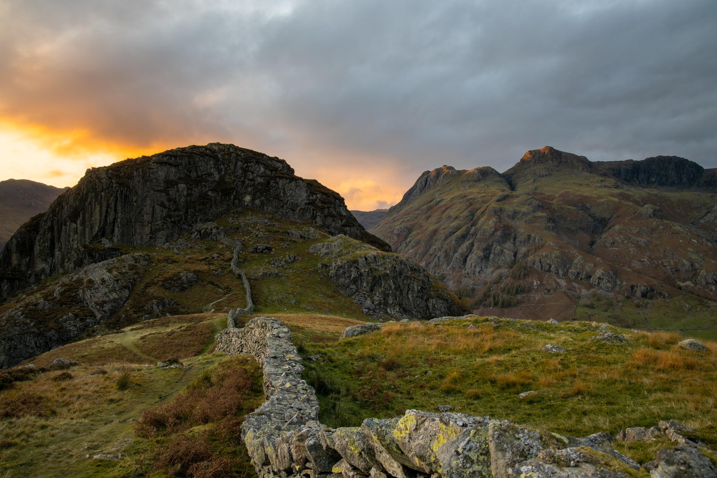 As we descended the ridge of Lingmoor Fell, the last beams of sunset broke through and kissed the very tops of the Langdale Pikes.